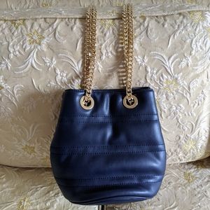Blue purse with adjustable gold chain atrap